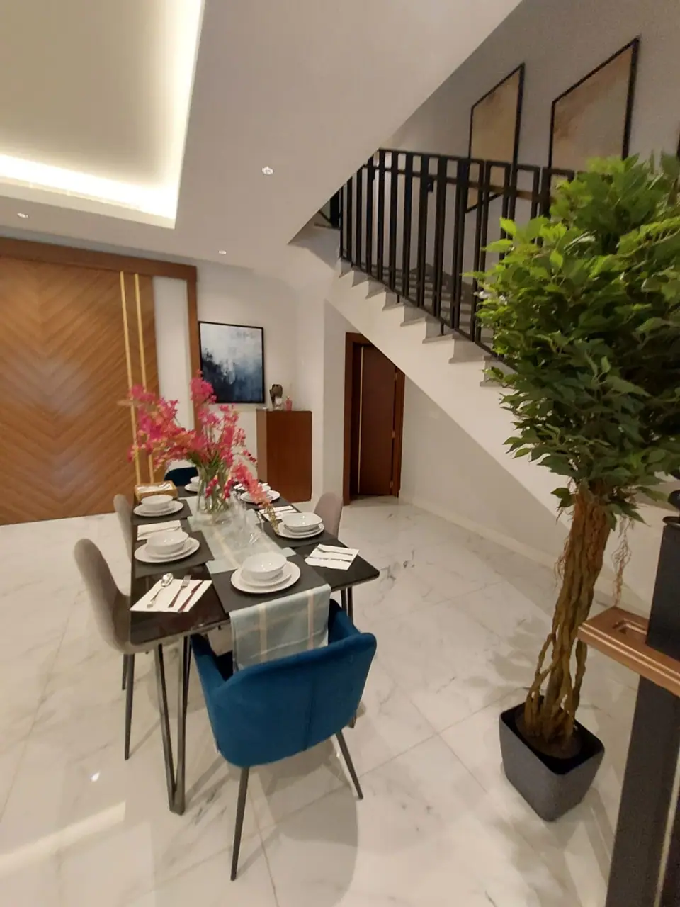 Dining area and staircase inside a villa