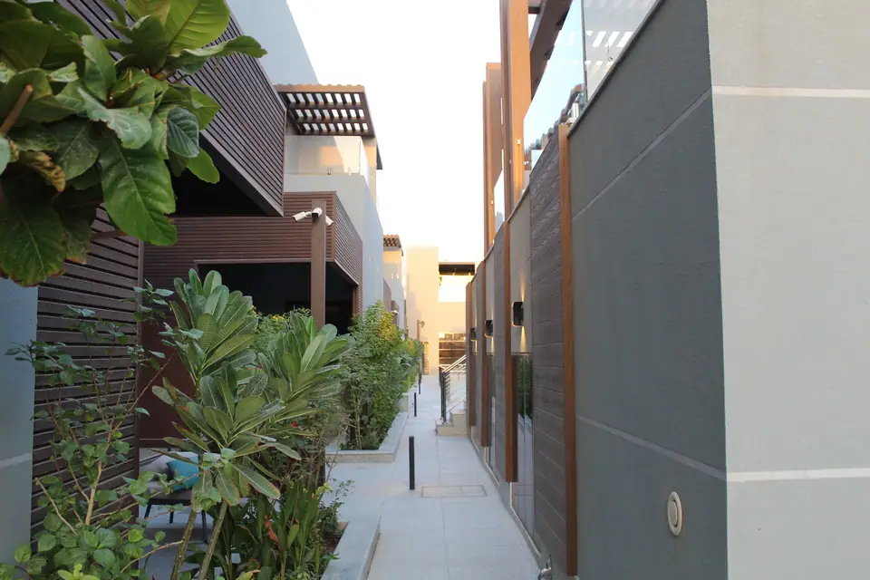 Planted walkway between the homes