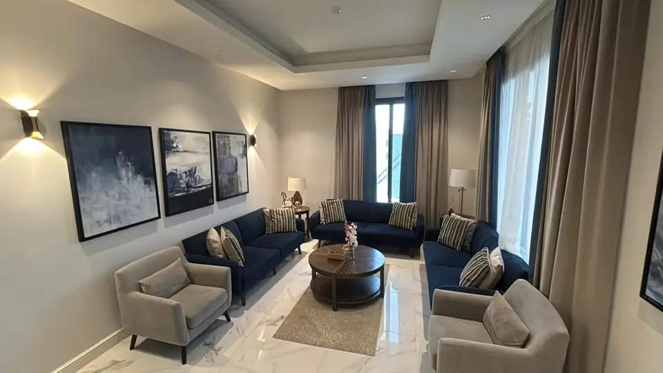 Furnished living room in a Fay Compound villa