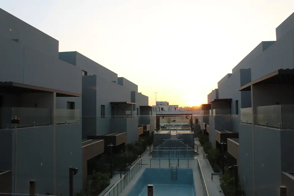 The courtyard pool between the villas at sunset